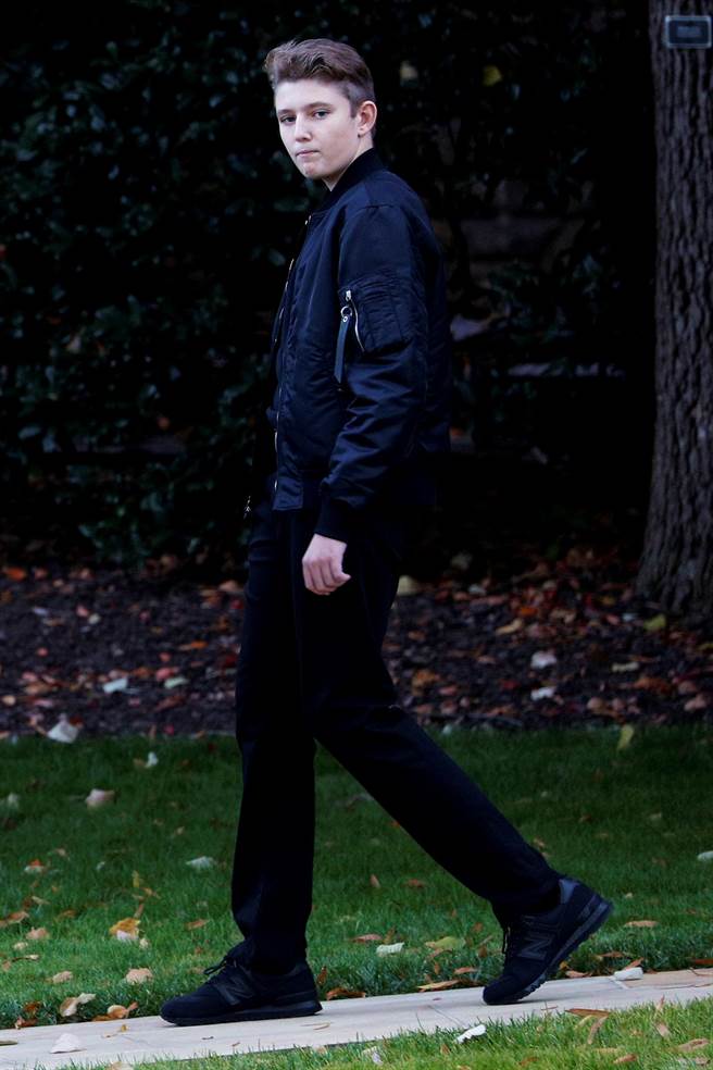 美国总统川普与第一夫人梅兰妮亚的13岁儿子拜伦。（图／路透社）