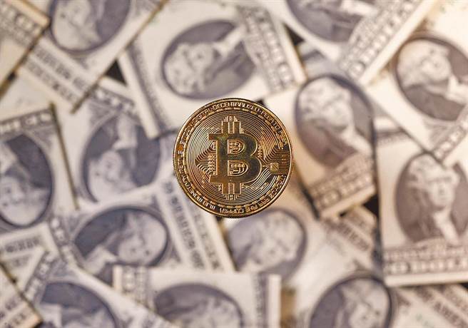 比特币再创歷史新高，来到57492美元，再度刷新歷史纪录。（路透）
