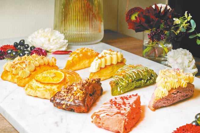 微风台北车站「英格莉莉」独家贩售8款皇家殿堂三角司康，口味有微笑起司、南洋椰香、京都浓郁抹茶、期待相芋、好事花生、加州香橙、70%苦甜可可、又见莓好，价格店洽。（微风提供）