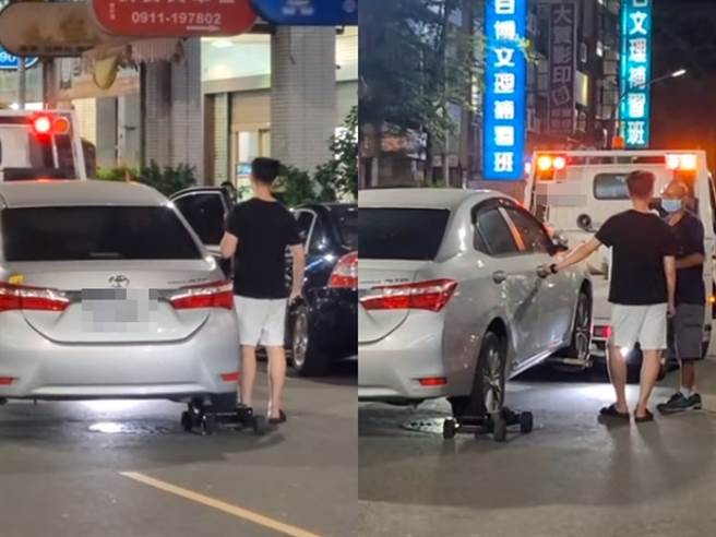 高雄市1名車主昨（20）日違停路邊遭拖吊，轎車當時已被裝上輔助輪並已拖到路中，沒想到車主卻急忙掉出來「盧小小」，甚至一度企圖打開車門。（翻攝自臉書「爆料公社」影片）