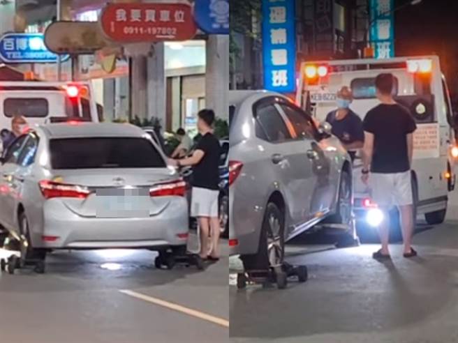 高雄市1名車主昨（20）日違停路邊遭拖吊，轎車當時已被裝上輔助輪並已拖到路中，沒想到車主卻急忙掉出來「盧小小」，甚至一度企圖打開車門。（翻攝自臉書「爆料公社」影片）