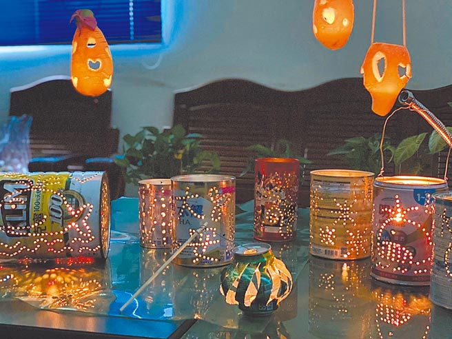 台中市大安區清潔隊利用廢棄奶粉罐打洞，製作成鯨魚懷舊提燈，別具特色。（環保局提供／林欣儀台中傳真）