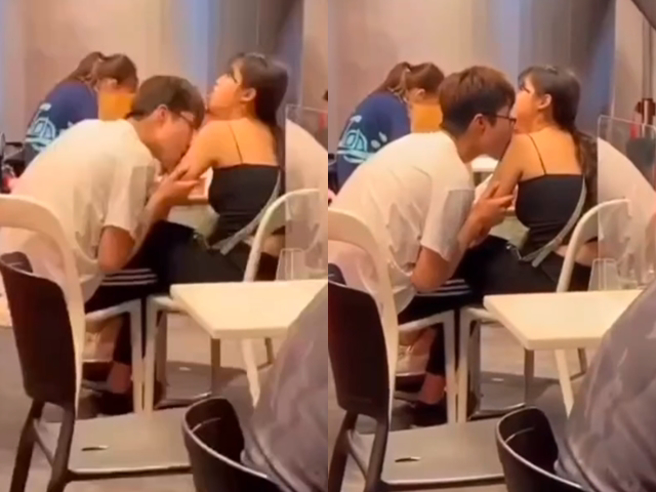 1对情侣在餐厅展现惊人的亲密行为，男方先是朝女方手臂猛亲，接着又大口含住女方肩膀，疑似还有「舔」的动作，最后男方才将嘴凑到女方嘴边接吻起来。（翻摄自脸书「爆废公社」）