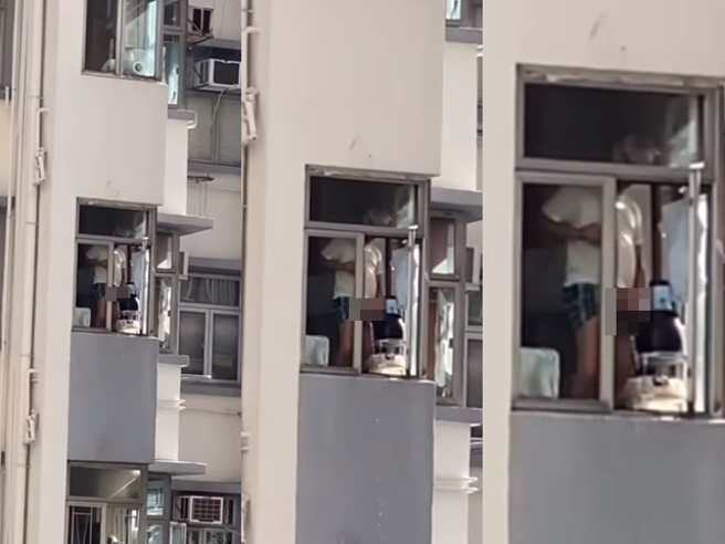 香港1名男子被拍到在高楼住家打开窗户「朝外尿尿」，噁心过程全被对面邻居所拍下，邻居痛骂真没水准。（翻摄自脸书「爆废公社公开版」）