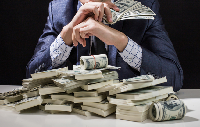 一個華爾街騙子，如何靠「行善又能致富」騙全球菁英？(示意圖／shutterstock)