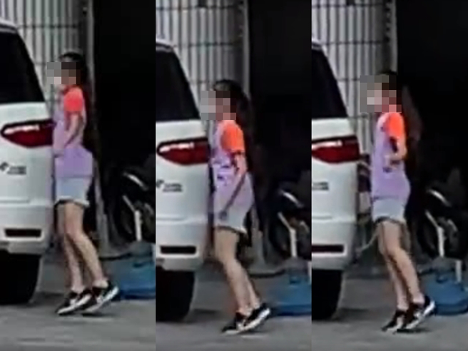 女童在馬路上，頂著30度高溫開合跳長達半小時，汗流浹背、表情相當痛苦，網友致電詢問補習班，補習班解釋是女童在外面補跳開合跳。（翻攝自臉書「爆怨公社」）