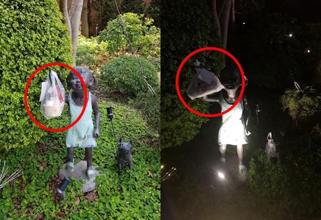 外送員連送2次都將餐點掛在小女孩銅像手中，網嚇：「晚上真的很可怕」。（圖／翻攝自爆廢公社）