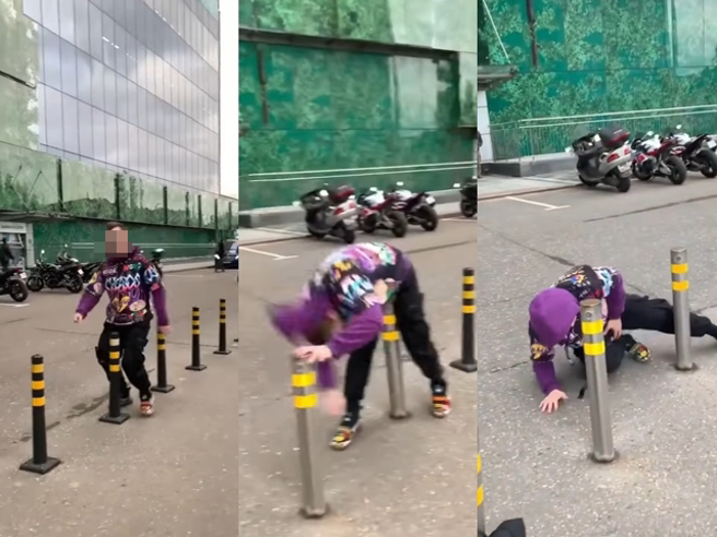 國外1名男子將雙腳跨在防撞桿2側，快步穿梭整排防撞桿，最後他不慎用下體撞向1根「鐵製」防撞桿。（翻攝自臉書「爆廢公社公開版」）