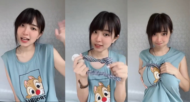 「绅士龙虾」拿起髮带却不是用来绑头髮，而是把她的傲人上围「圈」起来。（图／取自绅士龙虾Tik Tok）