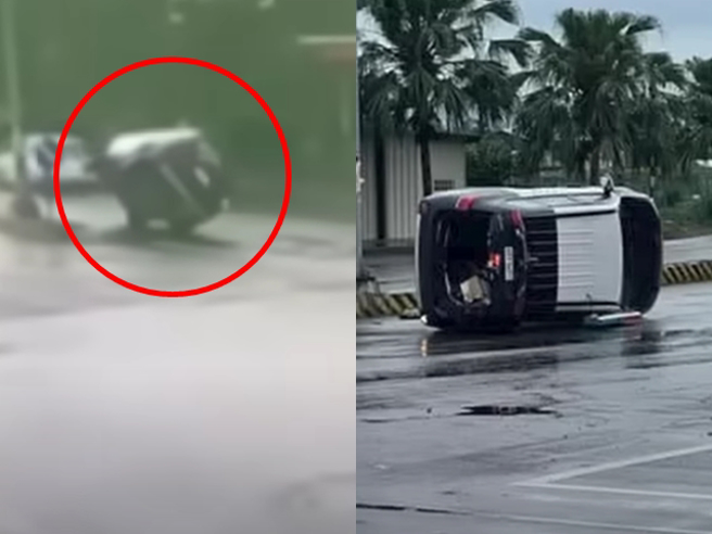 1辆警车在路口因不明原因朝路中分隔岛靠去，当场左车身往上翻「侧立路中」。（翻摄自YouTube频道「WoWtchout - 地图型行车影像分享平台」）