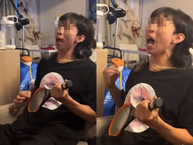 网路上有人分享1段抖音影片，1名男子竟拿电蚊拍当作当作电吉他，手指不断冒出电光，表情痛苦地演唱《hotel California》。（翻摄自脸书「爆废公社」）