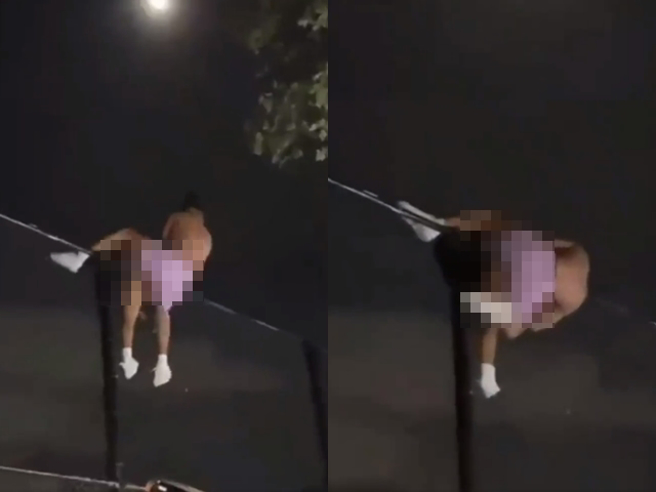 1段影片在网路疯传，1对男女在铁丝网围墙上忘情发生关系，2人卡在铁丝网最上方，男子压在女子身上，下半身猛抽动，不顾下方一票群眾。（翻摄自脸书「爆废公社公开版」）