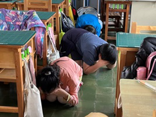 西松国小防空疏散避难演练。(图/台北市教育局提供)