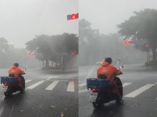 脸书上有网友分享1名外送员竟顶着恐怖风雨骑车跑单，在等红灯时被拍下，路面上全是遭砸落的树叶与瓜果，网友纷纷喊「先休息吧，安全第一呀」。（翻摄自脸书「外送员的奇闻怪事」）