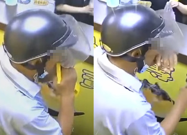 男子拿店家提供的酒精往鼻孔喷，疑似不舒服一直揉鼻子，店员看到后拿起另外1瓶酒精疯狂消毒。（翻摄自爆料公社）