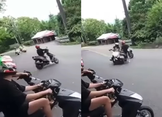 1群普通重型機車騎士在山路上欲迴轉，豈料，1騎士突然橫切衝出去，和重機擦撞倒地。（翻攝自記者爆料網公開版）