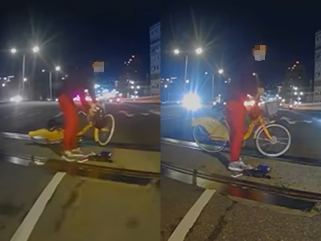 婦人騎Ubike竟「橫切」百齡橋，甚至在橋中央摔倒，1名汽車駕駛撞見，趕緊在婦人後方當忙擋車示警，但網友卻認為婦人一定會再犯。（翻攝自臉書「爆廢公社公開版」）