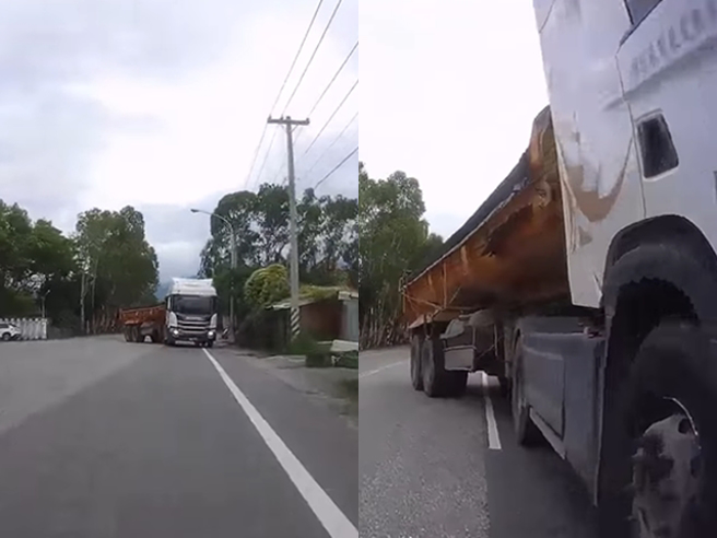 騎士發現遠方有輛大貨車準備迴轉，但貨車因迴轉半徑不足，開到逆向車道，騎士仍一路直行，最後幾秒才停下，開往貨車側邊離開，險釀成對撞。（翻攝自臉書「八卦村 - 行車紀錄器影片上傳中心」）