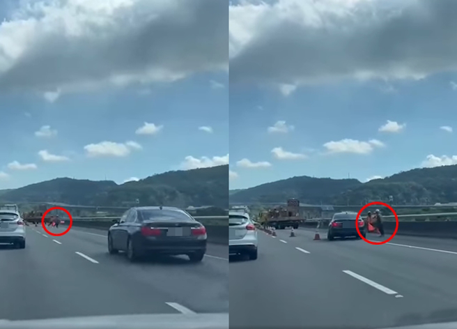 行车纪录器拍下，有辆BMW大7系列豪华车疑似未注意车前状况，差点就撞上外侧道路上的施工人员。（翻摄自脸书「记者爆料网」）
