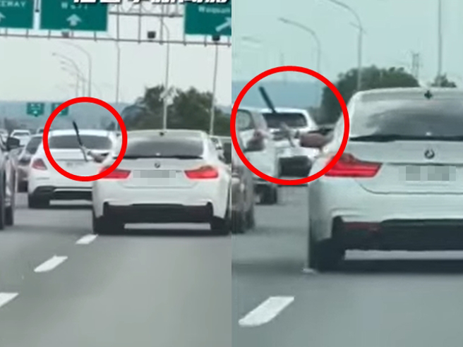 国1中港交流道1名BMW驾驶先在台湾大道与1名休旅车驾驶发生纠纷，2车开上国道后，BMW驾驶竟摇下车窗「伸出球棒挥舞」并沿路逼车叫嚣。（翻摄自脸书「记者爆料网」）