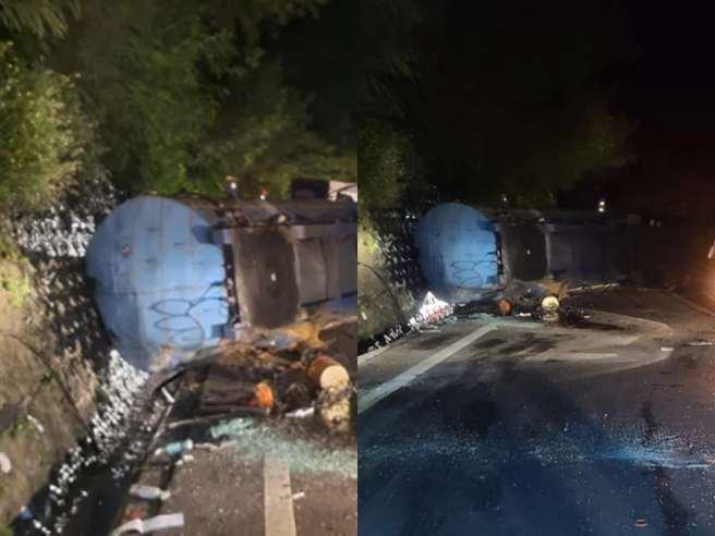 台9线屏东丹路段今（11）清晨发生1辆曳引车因不明原因自撞山壁，导致后方半拖车翻覆，车上载运的柏油当场喷溅山壁。（翻摄自记者爆料网）