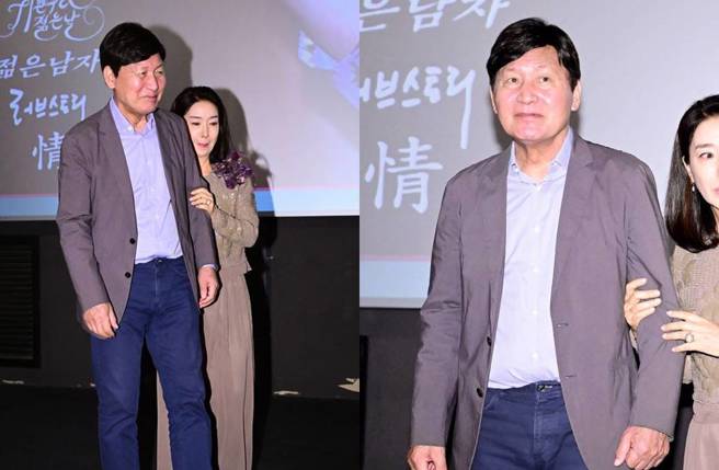 安聖基戴假髮出席活動，需旁人攙扶。(圖／翻攝自OSEN)