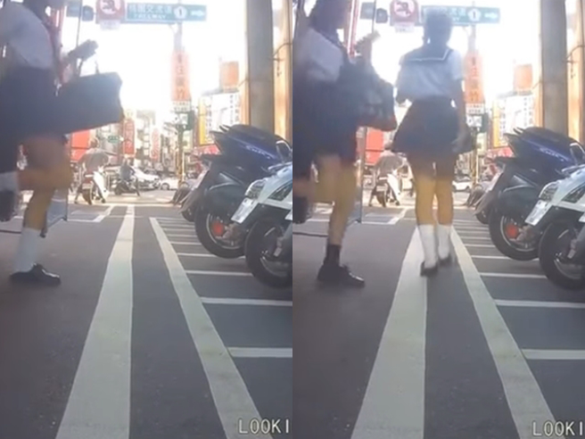 1名机车骑士发现前方有辆校车停在路中央，他往游览车右侧钻，发现校车竟直接开车门，让2名女学生下车，影片曝光网友全歪楼说机车视角太邪恶了。（翻摄自脸书「爆废公社二馆」）