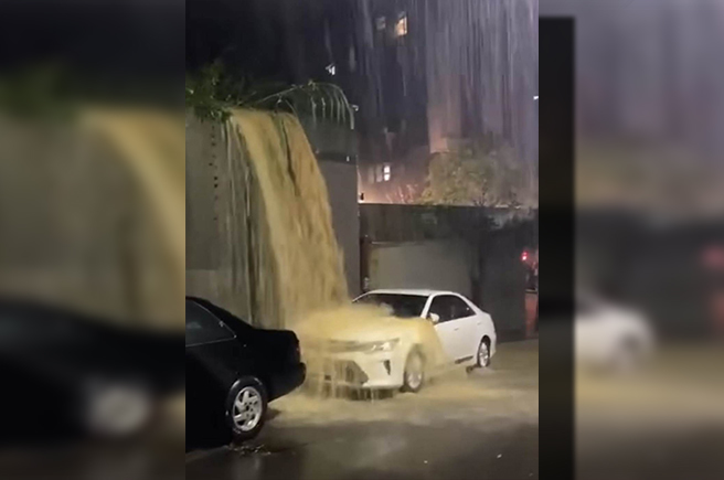 在北市內湖區驚見「泥沙瀑布」，一輛白色自小客車，剛好停在下方。（摘自我是內湖人社團）