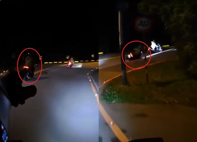 骑士在台2甲线上竹子湖路上1处髮夹弯被2机车超越，此时，他举起手指着1辆机车「指到的会摔车」，没想到竟然成真。（翻摄自YouTube频道「WoWtchout - 地图型行车影像分享平台」）