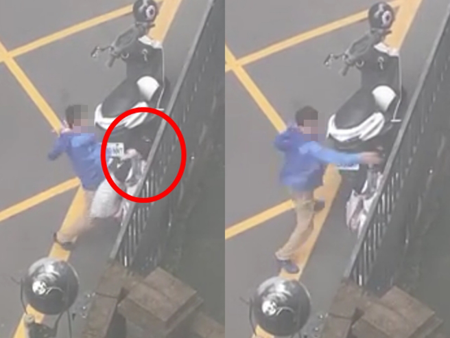 淡水一对夫妻在街头因不到1岁孩子的教育问题起争执，孔姓丈夫竟当眾朝对方头部大力甩打4下，妻子当时还抱着孩子，3名路人见状赶紧衝上前制止。（翻摄自Dcard）
