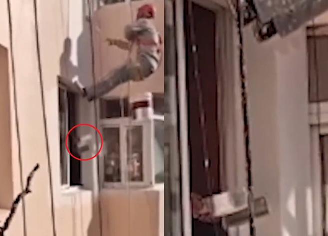 有名油漆工在做大樓外牆重新新粉刷工程時，竟遭1住戶老翁，開窗門朝他揮砍，驚嚇不已。（翻攝自微博）