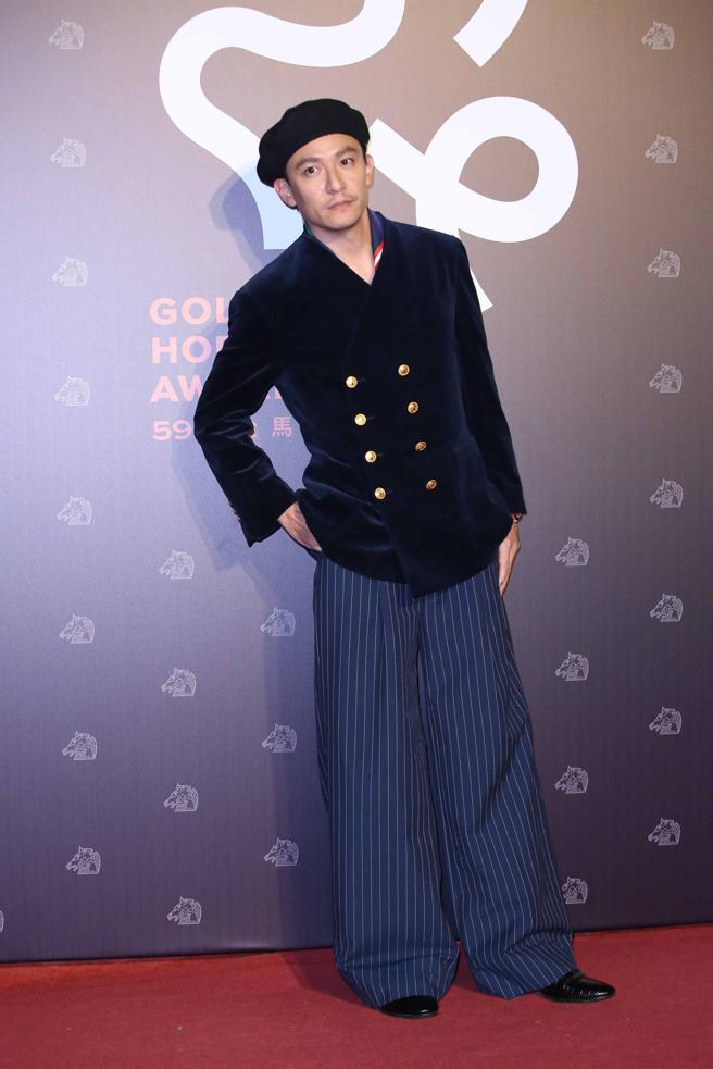 张震以GUCCIGucci Exquisite系列秀上款西装亮相，时髦有型的装扮广受好评。（陈俊吉摄）