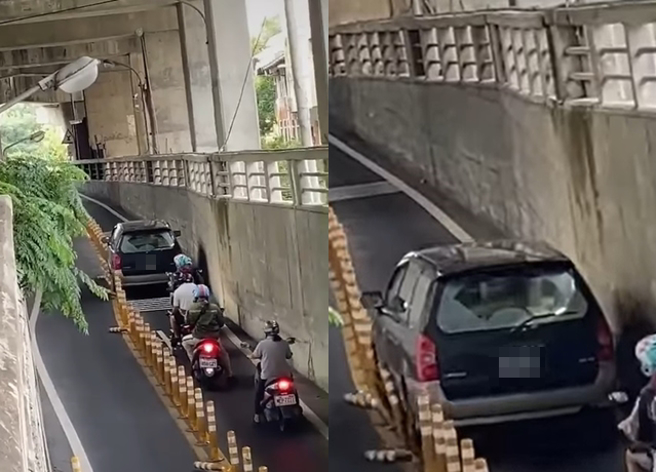 休旅车驾驶不慎误闯机车引导，整辆车塞满道路狂辗路中央的黄色防撞杆。（翻摄自脸书爆废公社公开版）