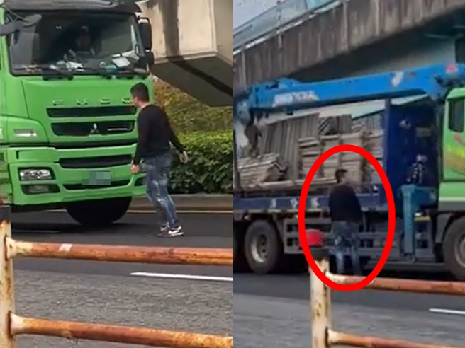 桃园市大兴西路三段上国道2号匝道前道路今（7）早发生一名男子严重酒醉后，竟跑到路中间不断挥手拦车，大货车、轿车纷纷被拦下后赶紧躲开。（翻摄画面）