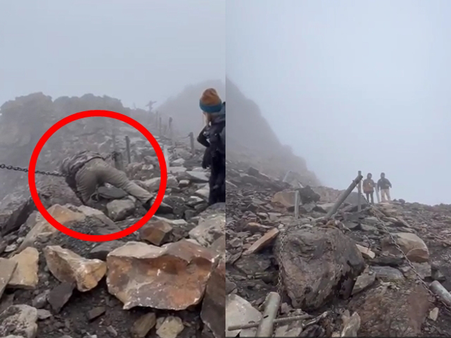 玉山主峰发生落石砸伤5人，现场画面曝光，只见山路布满大大小小的碎石，其中一名男子头部遭砸伤，倒在路边链条上疑似已失去意识。（翻摄画面）