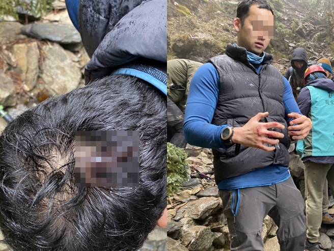 玉山主峰发生落石砸伤5人，现场画面曝光，只见山路布满大大小小的碎石，其中一名男子头部遭砸伤，倒在路边链条上疑似已失去意识。（翻摄画面）