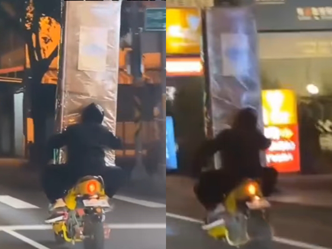 一辆机车载着高耸的大型家具，拍摄者原以为是一名骑士环抱家具后独自上路，吓问「这样真的看得到路吗？」但真相是机车上有2个人，家具放在2人中间。（翻摄自「社会事新闻影音」）