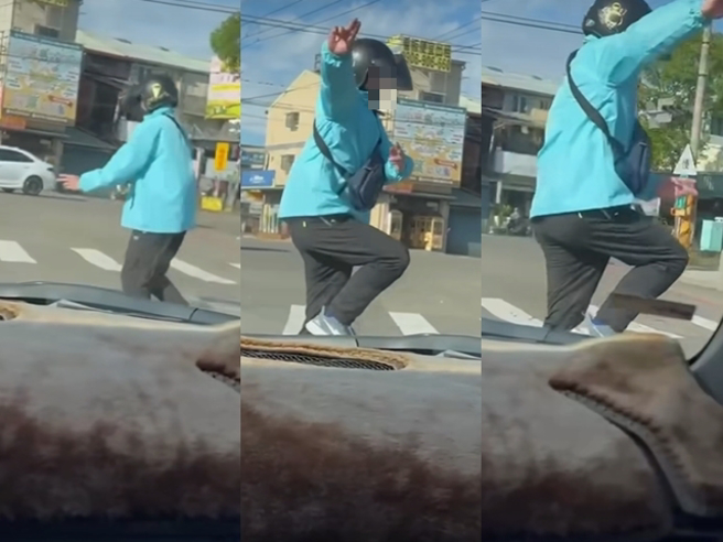 男骑士骑到一半突然双手摊开向后躺平，展现超强平衡力，之后在停等红灯时，又下车到路中央手舞足蹈，最后闯红灯离去。（翻摄自脸书「黑色豪门企业」）