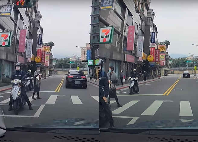 駕駛在路口禮讓行人時，被行人不斷揮手示意先過，雙方堅持了一陣子後，行人竟掉頭往回走。（翻攝自YouTube頻道「WoWtchout - 地圖型行車影像分享平台」）