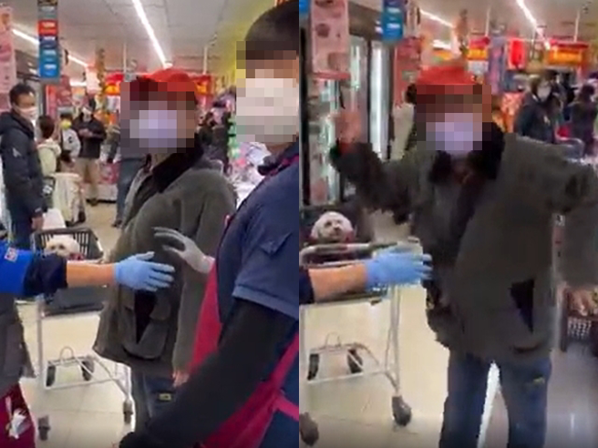 男子把爱犬放在购物提篮内，有其他民眾看不下去劝阻，双方爆发口角、互骂三字经，该男子还比出YA手势要其他人拍他。（翻摄自爆料公社）