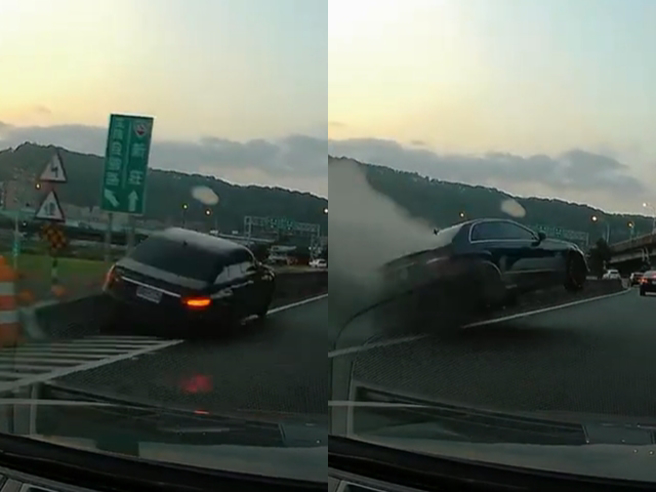 国道一号五股段昨（2）发生一辆黑色宾士车打右转灯要下匝道时，突然猛往左偏，直接鬼切至内车道开上分隔岛，车身腾空摔回路面。（翻摄自YouTube频道「WoWtchout - 地图型行车影像分享平台」）