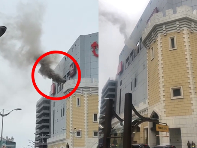 芦竹台茂购物中心今下午近2点惊传火警，阵阵浓烟从6楼窗户冒出，消防人员获报到场。（翻摄照片）