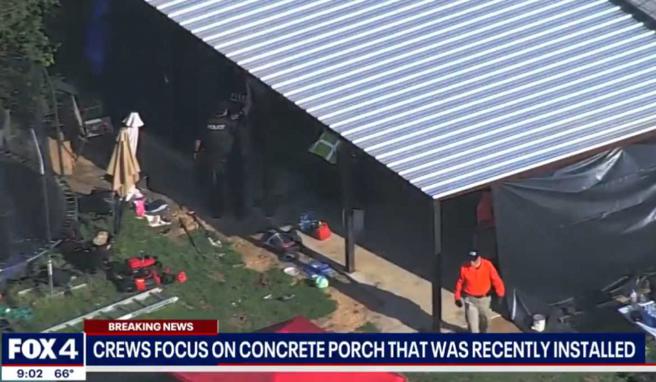 警方人员切开水泥地并挖掘底下土壤。