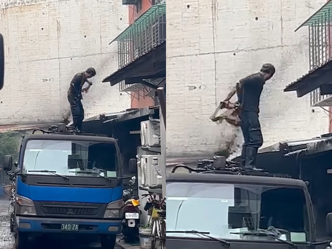 日前一辆沥青槽车在路上发生意外，车顶喷出大量沥青，导致一旁公寓墙壁、大门、窗户全被沥青覆盖「涂黑」，连工人抢修都被沥青淋全身。（翻摄自脸书「爆料公社」）