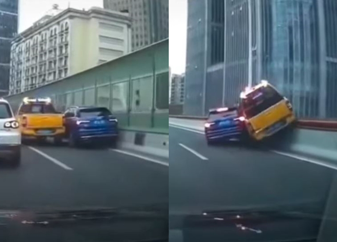 1辆奥迪休旅车与工程车在大陆上海高架上发生严重行车纠纷，2车险翻出高架桥。（翻摄自微博）