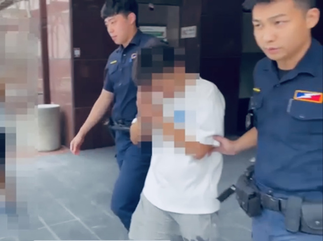 警方移送陈嫌画面。（照片 / 台北市保安警察大队提供）