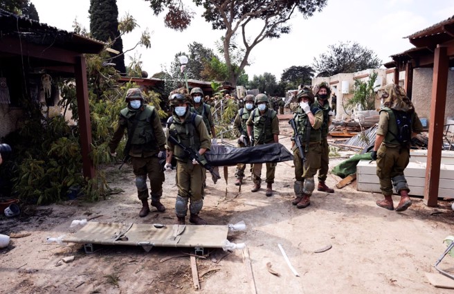 哈马斯突击以色列集体农场，死伤傪重 。(图/路透社)