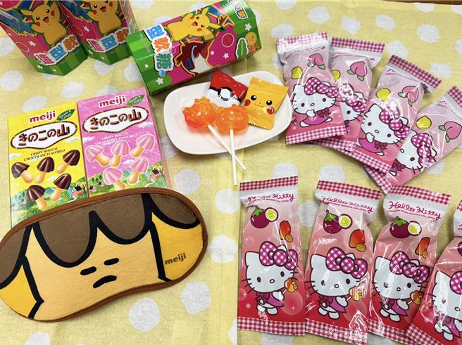 OKmart以有趣肖像的糖果饼乾迎战万圣搞怪商机，同时与明治合作推买零食送眼罩活动。（OKmart提供／朱世凯台北传真）