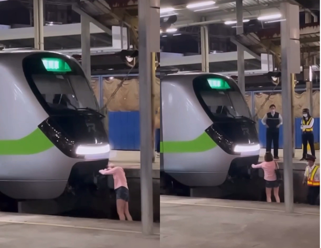 女子喝酒醉跳进月台轨道，还拍在火车头上呼呼大睡。（翻摄画面）