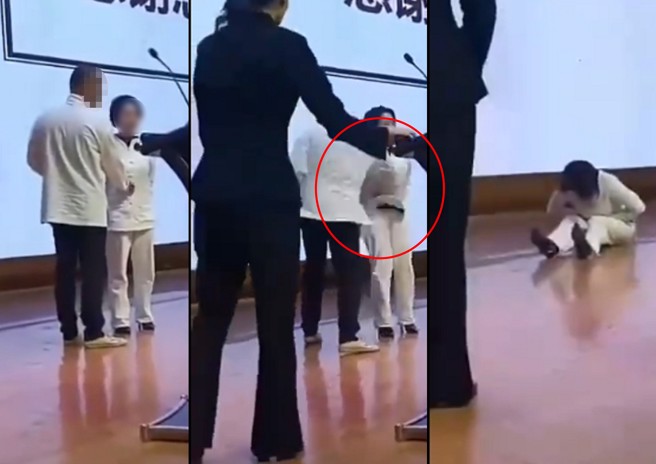 大妈上台示范点穴，却被大师一拳击倒。（翻摄徐晓冬X）